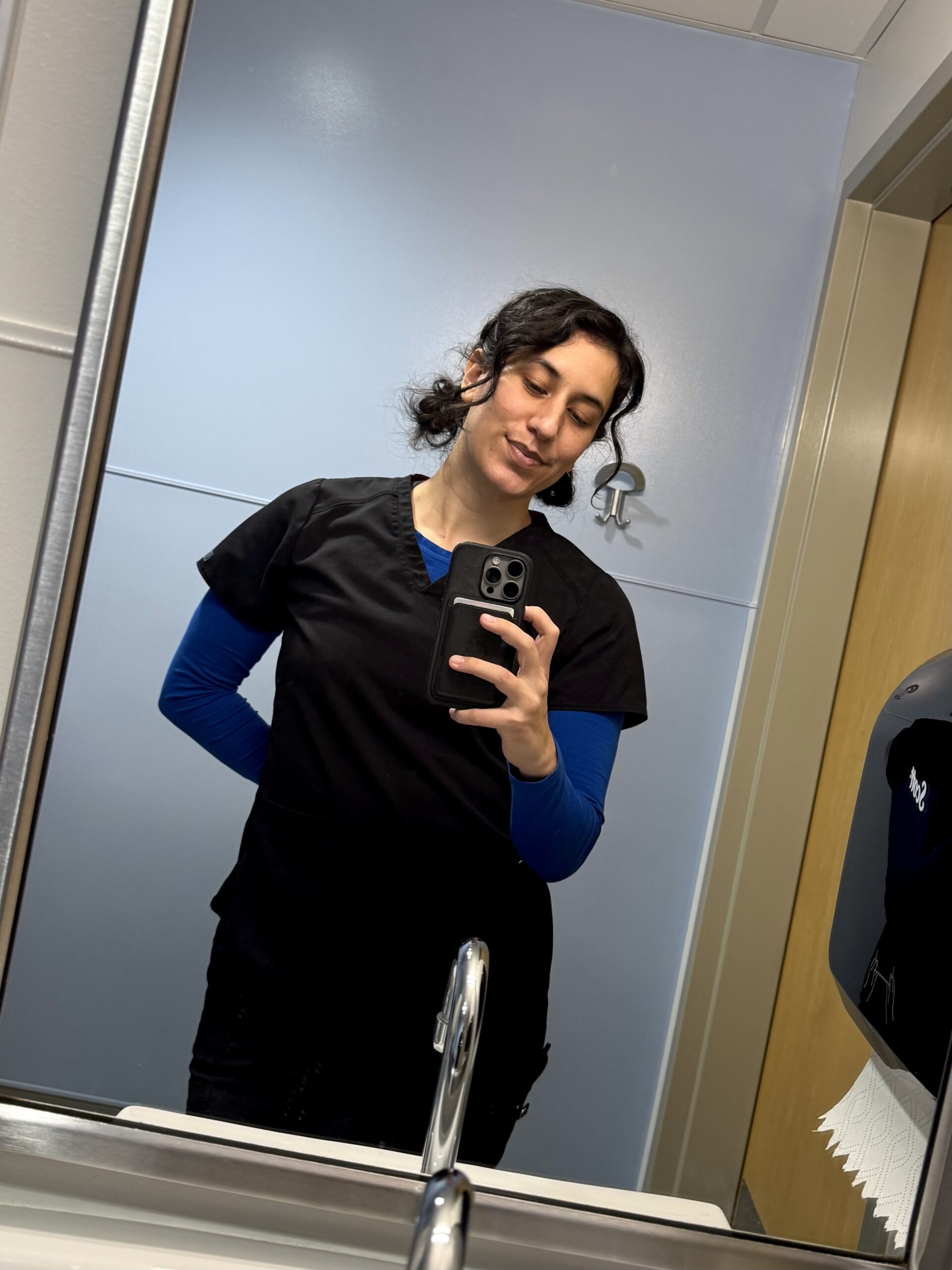 sleep-deprived nurse founder, Bridget, in scrubs at work