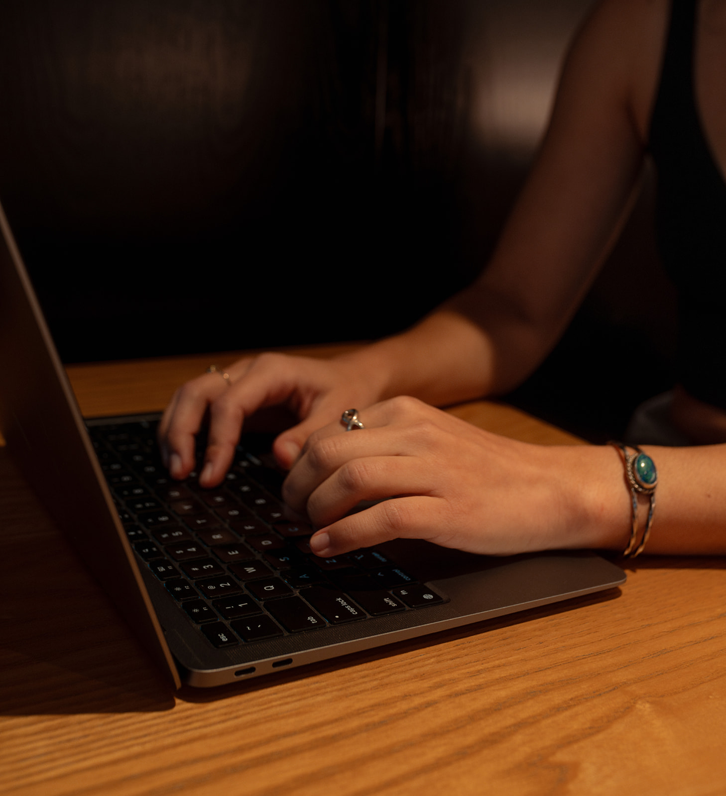 Bridget's hands typing on her computer